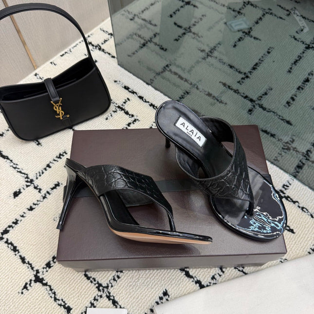 ALAIA 26S HEELED THONG MULE SANDALS IN BLACK CALFSKIN