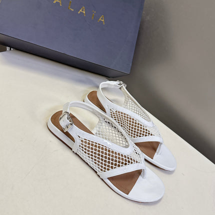 ALAIA 26S FLAT MESH THONG SANDALS IN WHITE PATENT CALFSKIN
