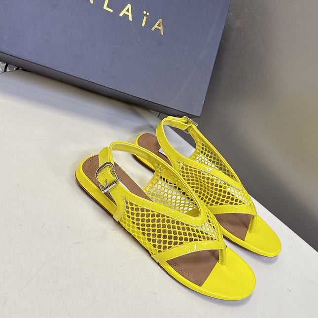 ALAIA 26S FLAT MESH THONG SANDALS IN YELLOW PATENT CALFSKIN