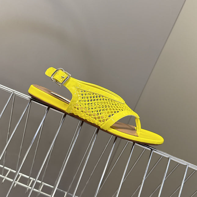 ALAIA 26S FLAT MESH THONG SANDALS IN YELLOW PATENT CALFSKIN