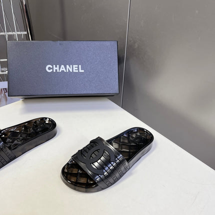 CHANEL 26S SLIDES IN BLACK PVC