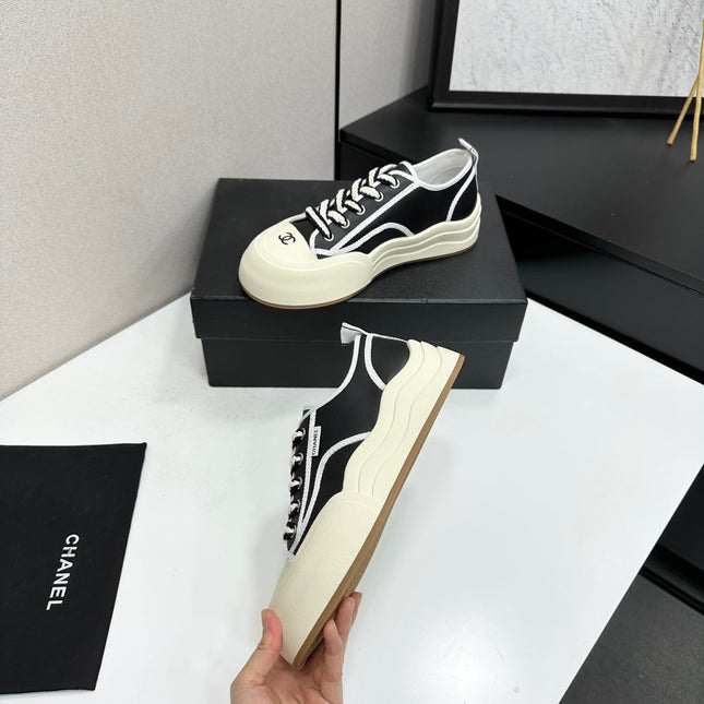 CHANEL 26S PLATFORM SNEAKERS IN BLACK AND WHITE CALFSKIN