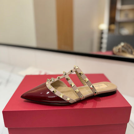 VALENTINO 26S STUDDED FLAT MULES IN DARK RED PATENT CALFSKIN