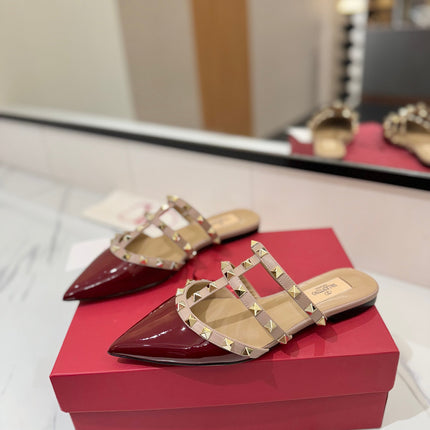 VALENTINO 26S STUDDED FLAT MULES IN DARK RED PATENT CALFSKIN