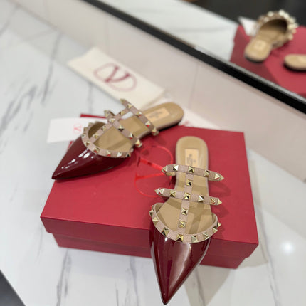 VALENTINO 26S STUDDED FLAT MULES IN DARK RED PATENT CALFSKIN