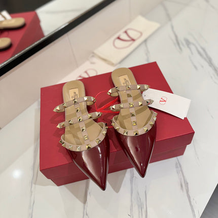 VALENTINO 26S STUDDED FLAT MULES IN DARK RED PATENT CALFSKIN