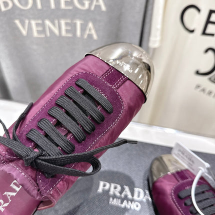 PRADA 25S MULES IN PLUM WITH METAL TOECAP