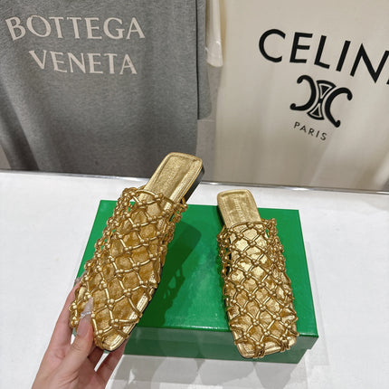 BOTTEGA VENETA 26S WOVEN MULES IN GOLD LAMBSKIN