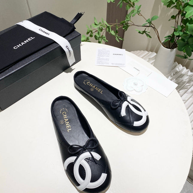 CHANEL 26S FLAT MULES IN BLACK LAMBSKIN