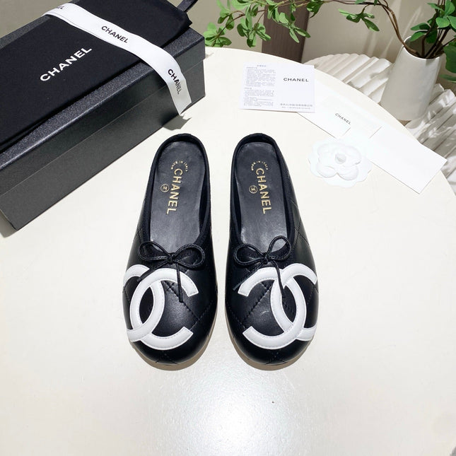 CHANEL 26S FLAT MULES IN BLACK LAMBSKIN