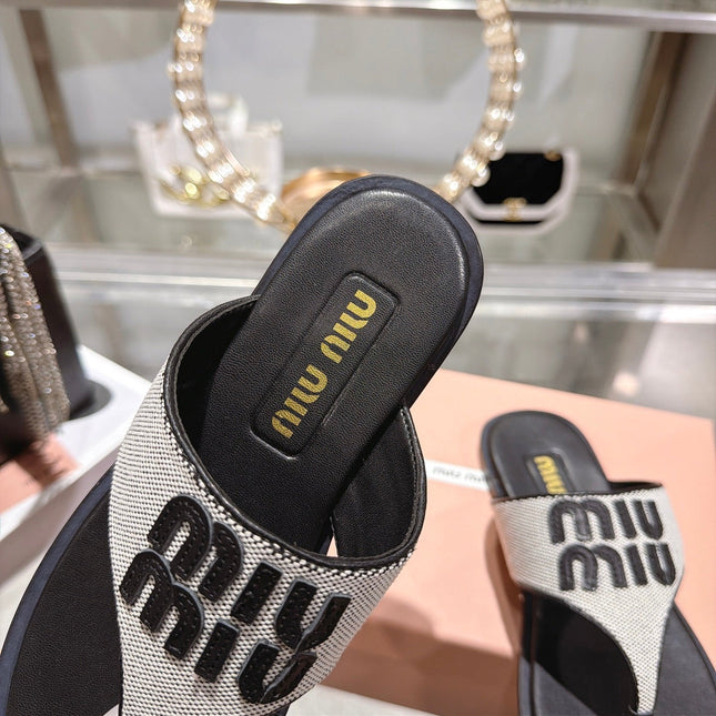 MIUMIU 26S THONG SANDALS IN WHITE CANVAS AND BLACK CALFSKIN LOGO