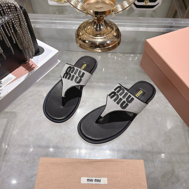 MIUMIU 26S THONG SANDALS IN WHITE CANVAS AND BLACK CALFSKIN LOGO