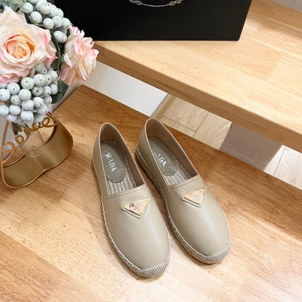 PRADA 26S LOGO ESPADRILLE SLIP ON FLATS IN DARK BEIGE CALFSKIN