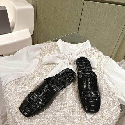 FLAT MULES IN BLACK CROCODILE EMBOSSED GLOSSY CALFSKIN