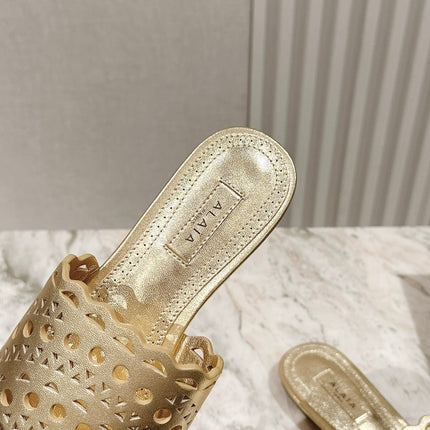 ALAIA PERFORATED SLIDE SANDALS 25S IN LIGHT GOLD LAMBSKIN
