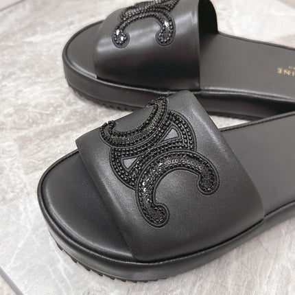 THICK-SOLED SLIDES IN BLACK SMOOTH LAMBSKIN LOGO WITH CRYSTALS