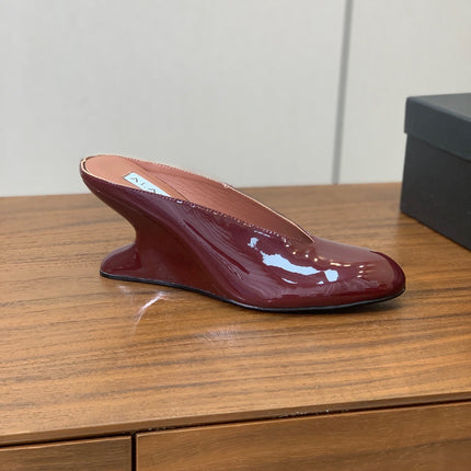 ALAIA 26S WEDGE MULES 70 MM IN DARK RED GLOSSY CALFSKIN
