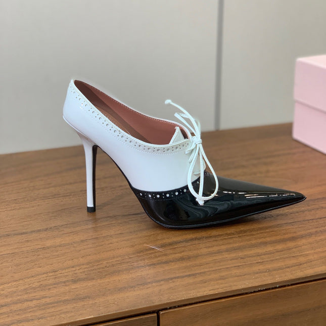 ALAIA 26S LACE-UP HEELED 105 MM IN BLACK AND WHITE GLOSSY CALFSKIN