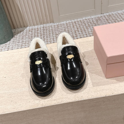 MIUMIU 25S PENNY LOAFERS 20MM IN BLACK PATENT CALFSKIN WITH SHEARLING