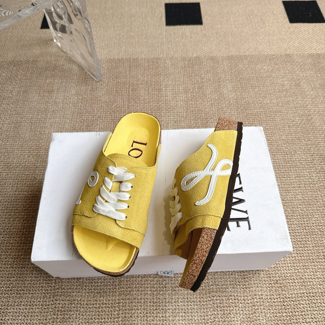 LOEWE 26S LACE-UP FLAT SLIDES IN YELLOW SUEDE
