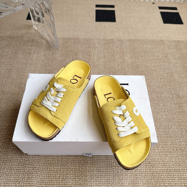 LOEWE 26S LACE-UP FLAT SLIDES IN YELLOW SUEDE