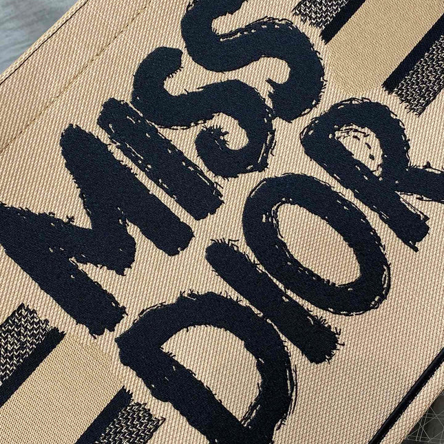BOOK TOTE 36 BEIGE AND BLACK MISS DIOR GRAFFITI EMBROIDERY
