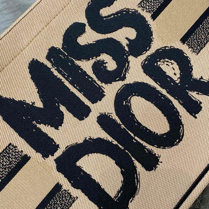 BOOK TOTE 36 BEIGE AND BLACK MISS DIOR GRAFFITI EMBROIDERY