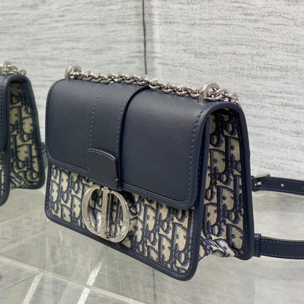 MONTAIGNE EAST-WEST 25 BAG WITH CHAIN IN NAVY BLUE LAMBSKIN AND MONOGRAM JACQUARD
