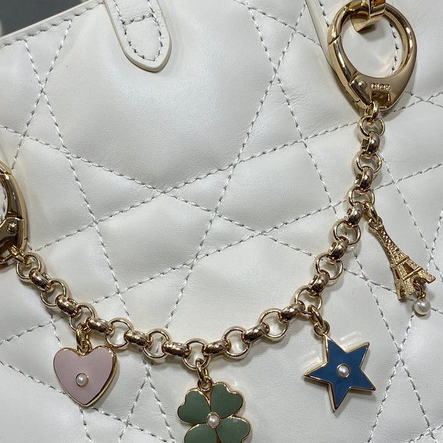 DIOR 25S TOUJOURS VERTICAL TOTE BAG 18 IN IVORY CALFSKIN WITH CHARM BRACELET STRAP