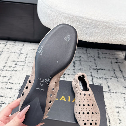 ALAIA 26S FLAT SLIP-ONS IN NUDE PINK SUEDE WITH OPENWORK PATTERN