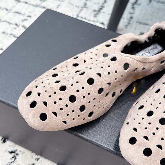 ALAIA 26S FLAT SLIP-ONS IN NUDE PINK SUEDE WITH OPENWORK PATTERN