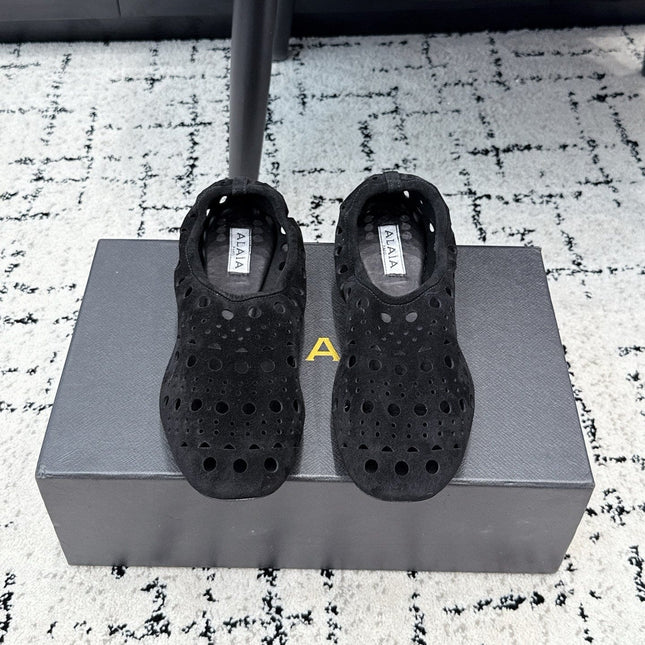 ALAIA 26S FLAT SLIP-ONS IN BLACK SUEDE WITH OPENWORK PATTERN