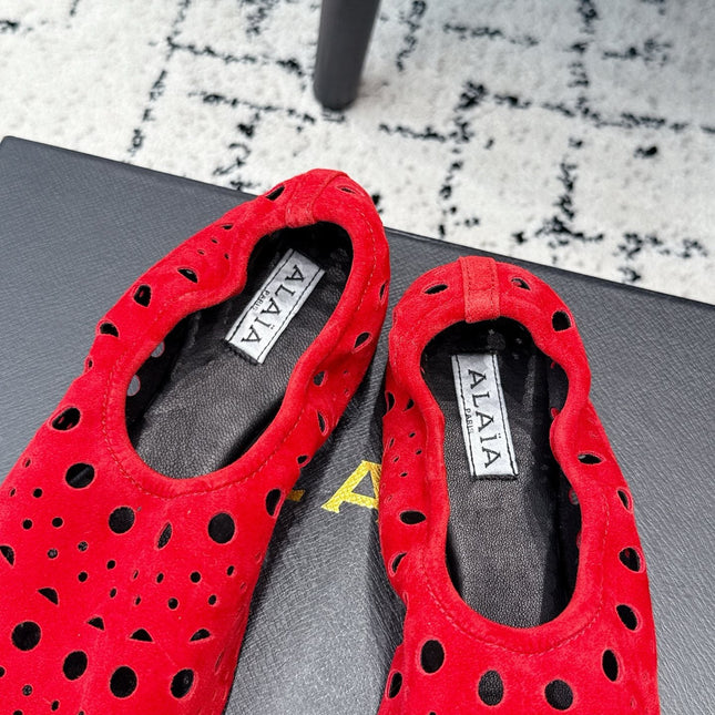 ALAIA 26S FLAT SLIP-ONS IN RED SUEDE WITH OPENWORK PATTERN