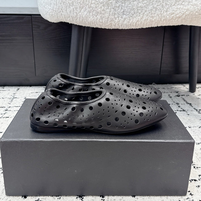 ALAIA 26S FLAT SLIP-ONS IN BLACK CALFSKIN WITH OPENWORK PATTERN
