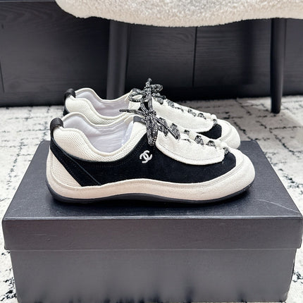 CHANEL 26S LACE-UP SNEAKERS IN WHITE AND BLACK SUEDE STYLE 2