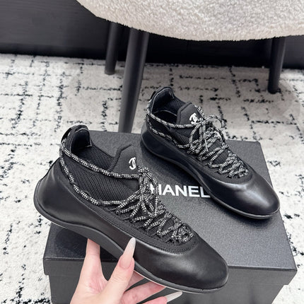 CHANEL 26S LACE-UP SNEAKERS IN BLACK FABRIC AND LAMBSKIN