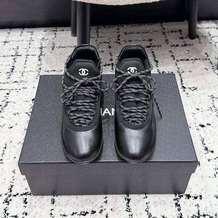 CHANEL 26S LACE-UP SNEAKERS IN BLACK FABRIC AND LAMBSKIN