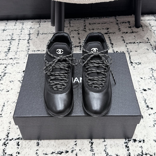 CHANEL 26S LACE-UP SNEAKERS IN BLACK FABRIC AND LAMBSKIN