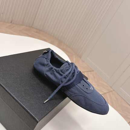 PRADA 26S LACE UP MINIMAL SNEAKERS IN NAVY BLUE CANVAS
