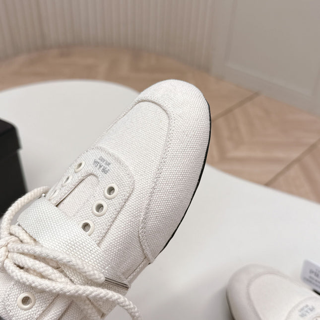 PRADA 26S LACE UP MINIMAL SNEAKERS IN WHITE CANVAS