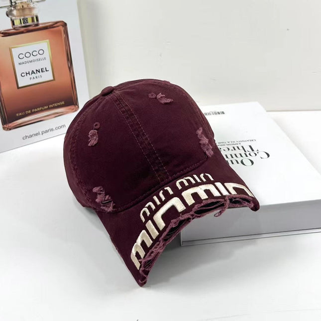 MIUMIU DISTRESSED EMBROIDERED BASEBALL CAP DENIM