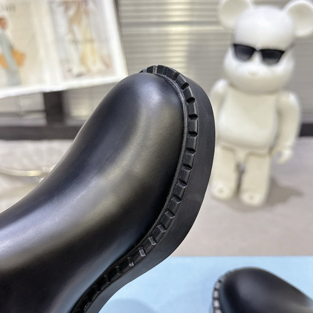 PRADA 25S RETRO PLATFORM MARTIN BOOTS IN BLACK CALFSKIN