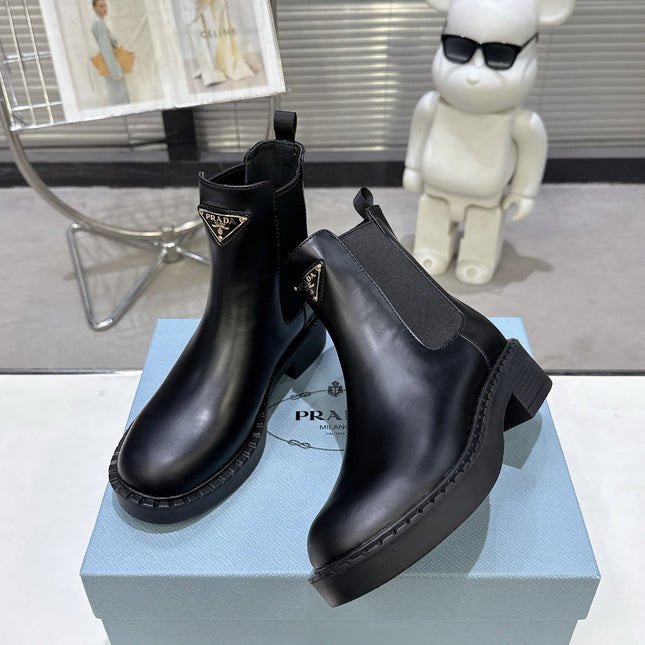 PRADA 25S RETRO PLATFORM MARTIN BOOTS IN BLACK CALFSKIN