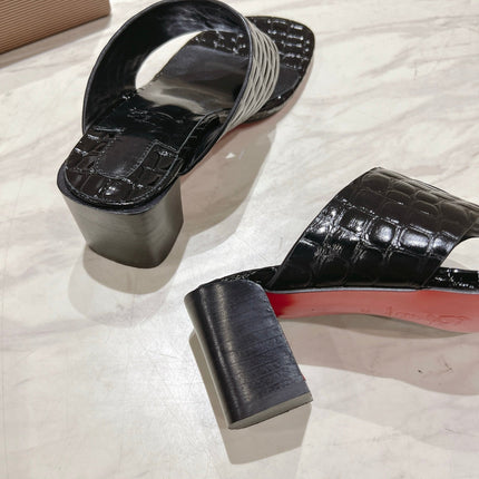 EMBOIDERED LOGO MULES IN BLACK EMBOSSED CALFSKIN