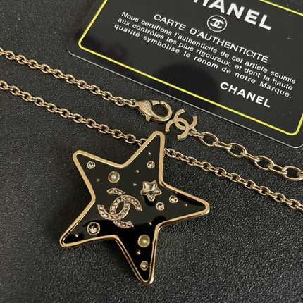 CHANEL 26S DOUBLE C LOGO BLACK ENAMEL STAR PENDANT NECKLACE WITH CRYSTAL DETAIL IN GOLD METAL 631015