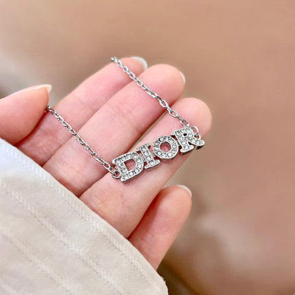 CD 26S PAVE LOGO LETTER BRACELET IN SILVER TONE METAL 631807