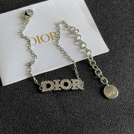 CD 26S PAVE LOGO LETTER BRACELET IN SILVER TONE METAL 631807