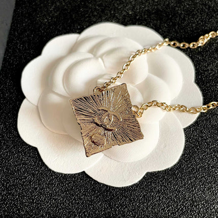 CHANEL 26S DOUBLE C LOGO AMBER CRYSTAL SQUARE PENDANT NECKLACE IN GOLD METAL 633294