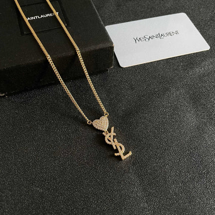 YSL 26S CRYSTAL HEART LOGO PENDANT NECKLACE IN GOLD TONE METAL 633939