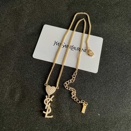 YSL 26S CRYSTAL HEART LOGO PENDANT NECKLACE IN GOLD TONE METAL 633939